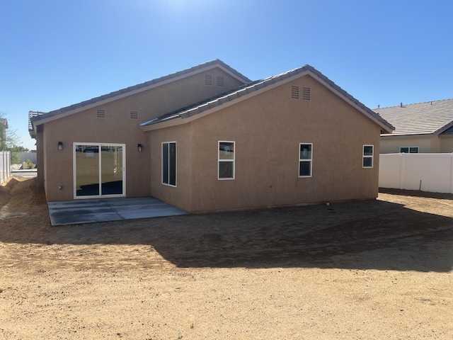 rear view of house with a patio