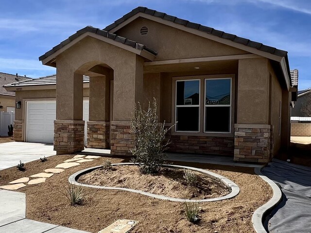 view of front of property with a garage