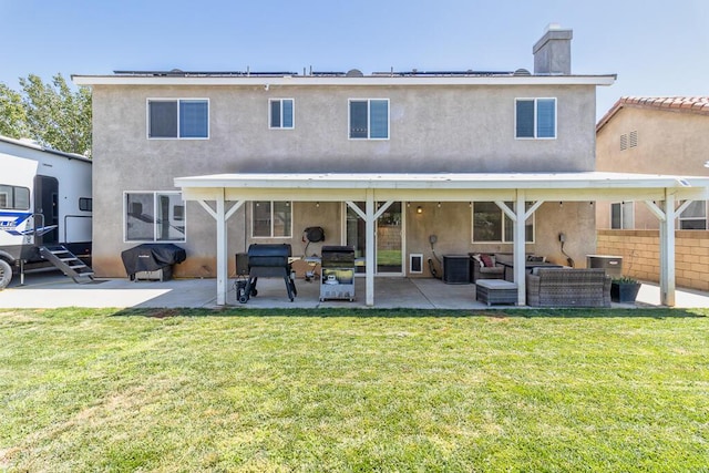 back of property with cooling unit, a patio area, an outdoor hangout area, and a yard