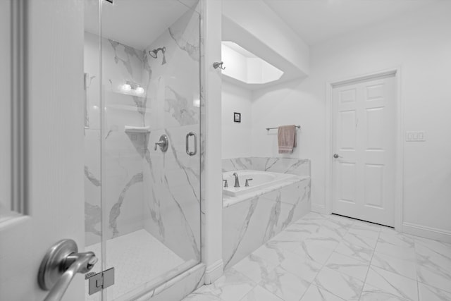 bathroom featuring separate shower and tub