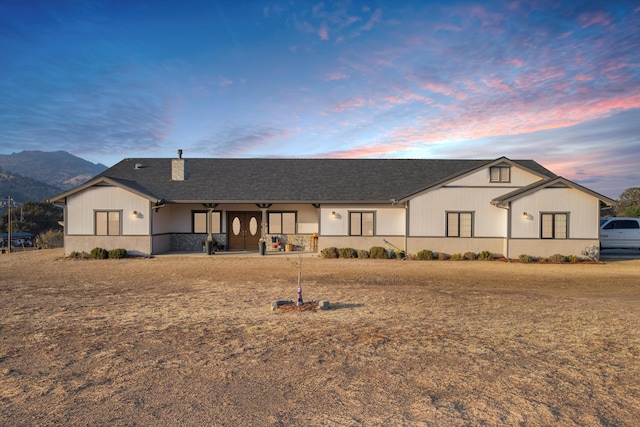 view of front of property with a mountain view