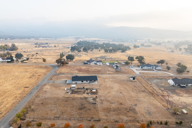 birds eye view of property with a rural view