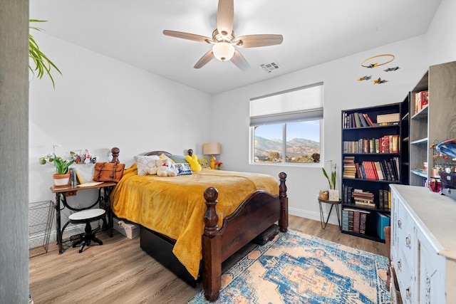 bedroom featuring ceiling fan and light wood-type flooring