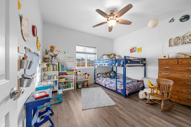 bedroom with hardwood / wood-style floors and ceiling fan