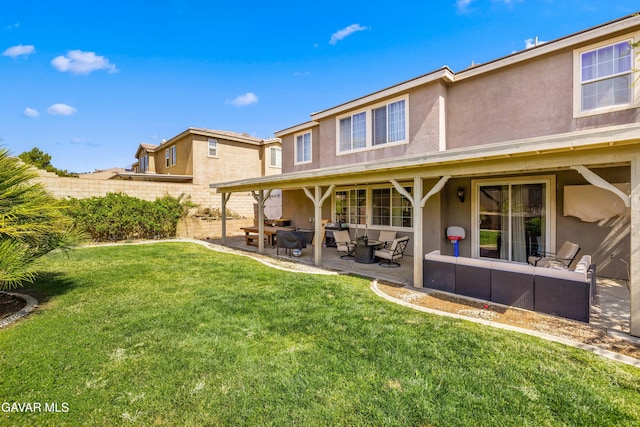 5080 Meadowsweet Dr, Palmdale, CA 93551 - rear view of property featuring stucco siding, an outdoor hangout area, and a patio area
