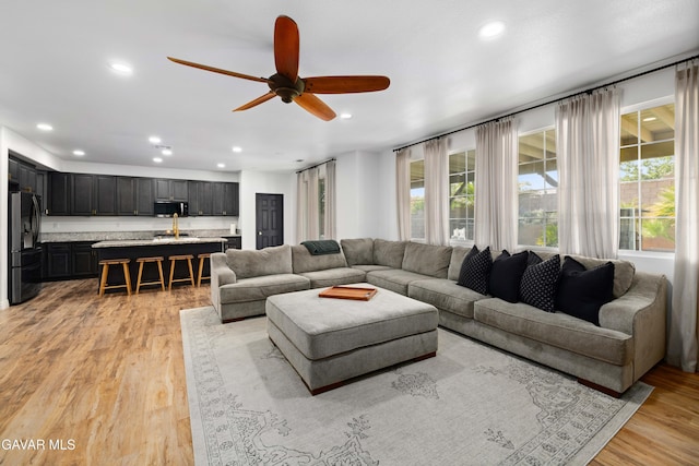 5080 Meadowsweet Dr, Palmdale, CA 93551 - living area with recessed lighting, ceiling fan, and light wood finished floors