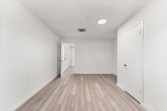 spare room featuring light hardwood / wood-style flooring