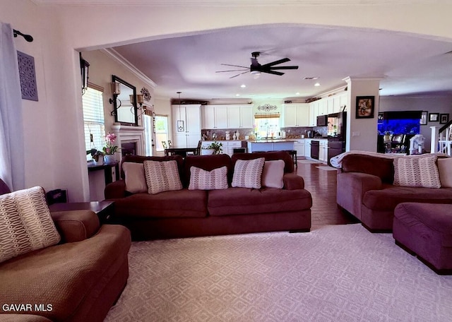 4011 Prestwick Ln, Palmdale, CA 93551 - living area featuring ornamental molding, a ceiling fan, wood finished floors, a fireplace, and recessed lighting