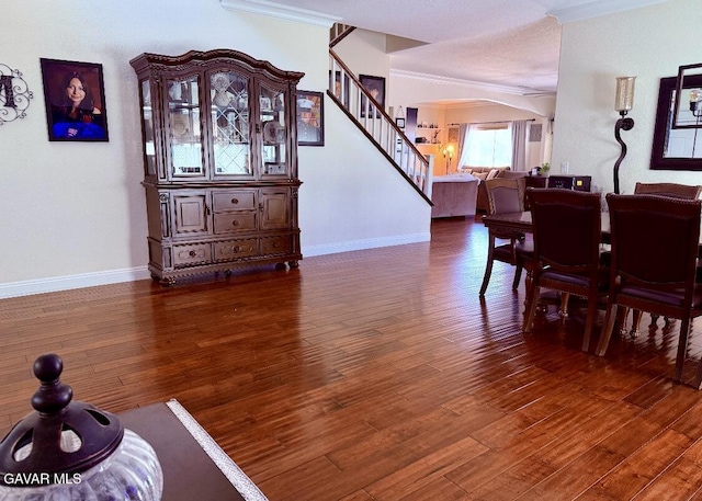 4011 Prestwick Ln, Palmdale, CA 93551 - dining room featuring ornamental molding, stairs, and wood finished floors