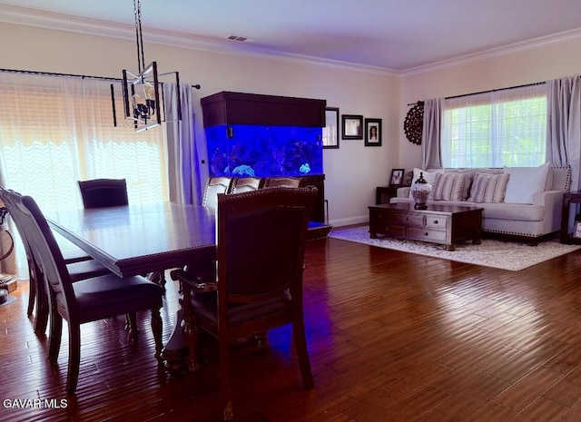 4011 Prestwick Ln, Palmdale, CA 93551 - dining area with a chandelier, crown molding, and wood finished floors