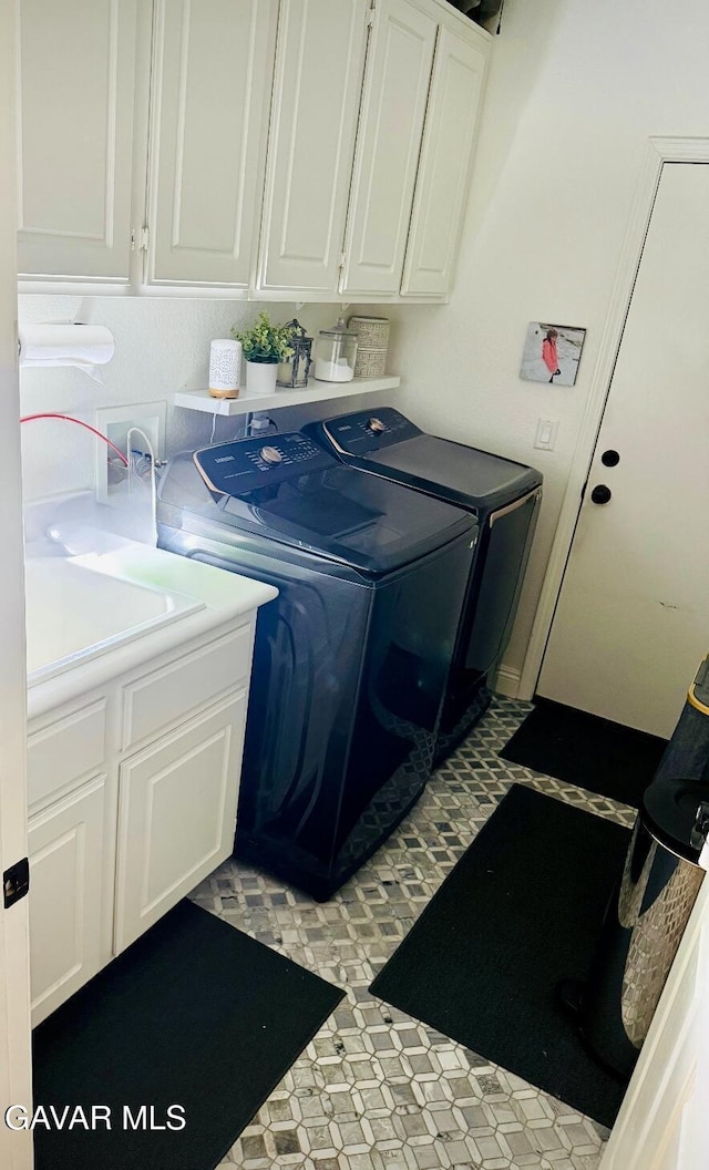 4011 Prestwick Ln, Palmdale, CA 93551 - laundry area featuring cabinet space, washing machine and dryer, and light floors