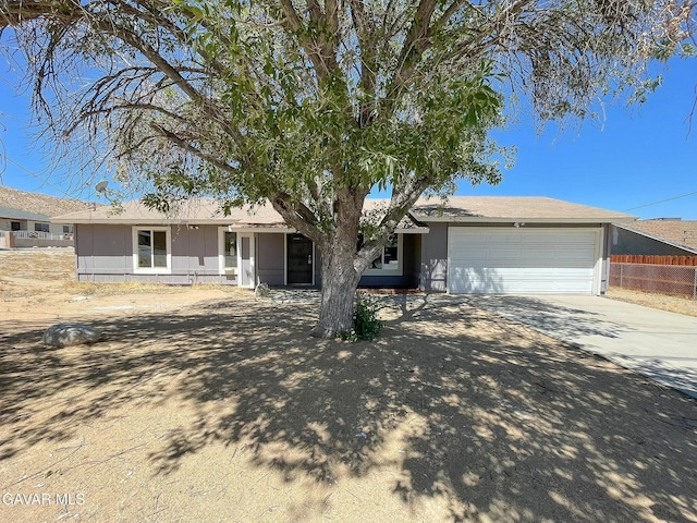 40205 E 162nd St, Palmdale, CA 93591 - ranch-style home with concrete driveway and an attached garage