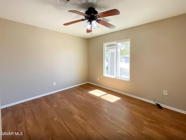 40205 E 162nd St, Palmdale, CA 93591 - empty room with wood finished floors and ceiling fan