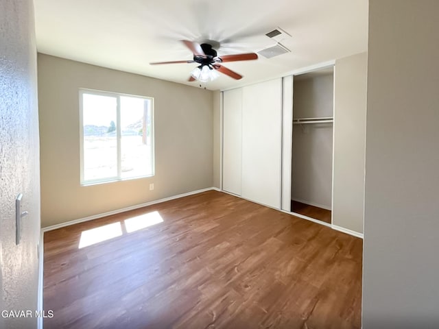 40205 E 162nd St, Palmdale, CA 93591 - unfurnished bedroom featuring wood finished floors, a closet, and a ceiling fan