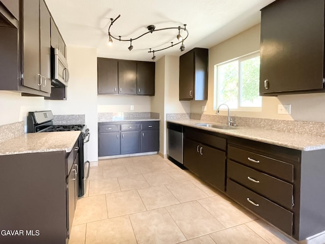 40205 E 162nd St, Palmdale, CA 93591 - kitchen featuring appliances with stainless steel finishes, light countertops, light tile patterned floors, and dark brown cabinetry