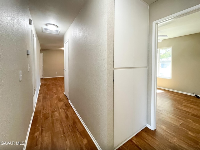 40205 E 162nd St, Palmdale, CA 93591 - corridor featuring wood finished floors and a textured wall