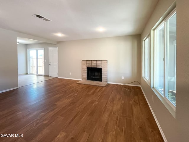40205 E 162nd St, Palmdale, CA 93591 - unfurnished living room with wood finished floors and a fireplace