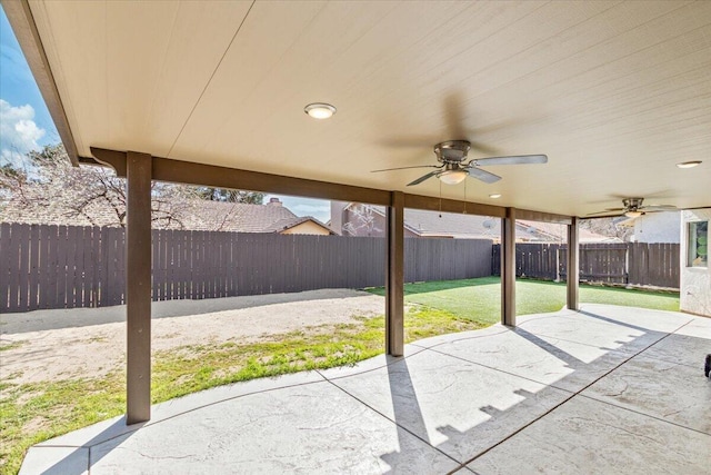 view of patio featuring a fenced backyard and a ceiling fan