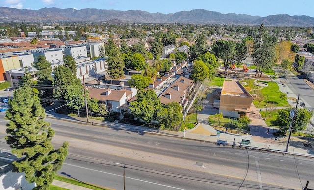 birds eye view of property with a mountain view