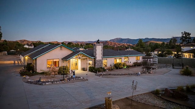 ranch-style home featuring a mountain view