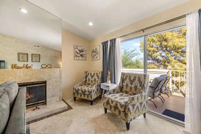 344 Vista Royal Dr, Palm Desert, CA 92211 - living area with vaulted ceiling, recessed lighting, and a tile fireplace