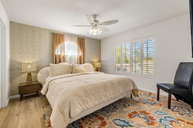 344 Vista Royal Dr, Palm Desert, CA 92211 - bedroom with baseboards, ceiling fan, light wood-type flooring, and wallpapered walls