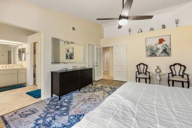 344 Vista Royal Dr, Palm Desert, CA 92211 - bedroom with ensuite bathroom, vaulted ceiling, and visible vents
