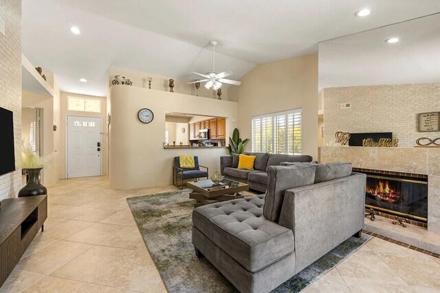 344 Vista Royal Dr, Palm Desert, CA 92211 - living area with ceiling fan, a fireplace, high vaulted ceiling, recessed lighting, and light tile patterned flooring