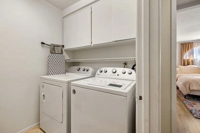 344 Vista Royal Dr, Palm Desert, CA 92211 - clothes washing area with baseboards, cabinet space, and washing machine and clothes dryer