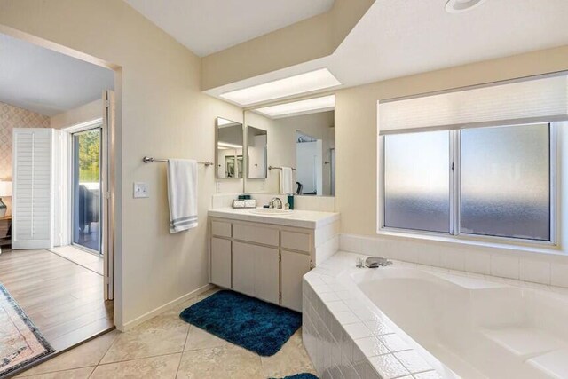 344 Vista Royal Dr, Palm Desert, CA 92211 - bathroom featuring baseboards, tile patterned flooring, a garden tub, and vanity