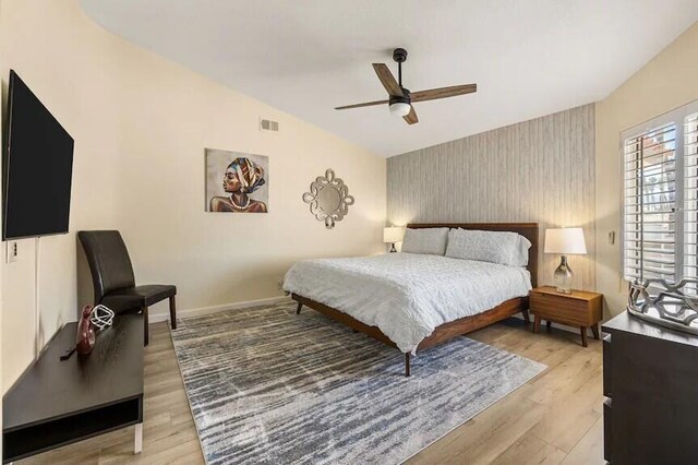 344 Vista Royal Dr, Palm Desert, CA 92211 - bedroom featuring an accent wall, light wood-type flooring, wallpapered walls, and visible vents