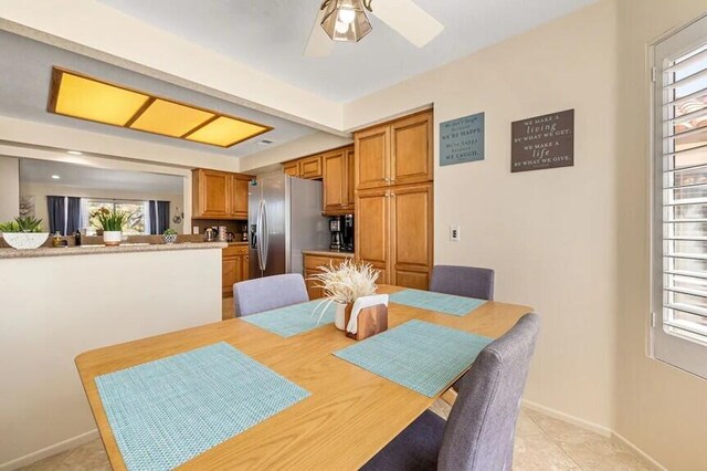 344 Vista Royal Dr, Palm Desert, CA 92211 - dining space featuring baseboards, a ceiling fan, light tile patterned floors, and a healthy amount of sunlight