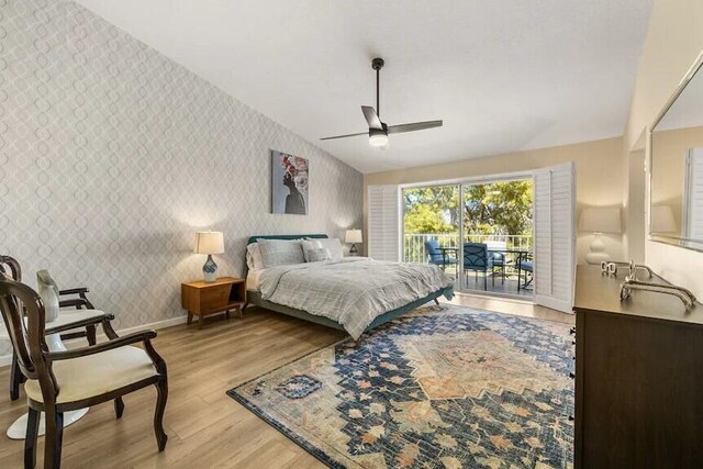344 Vista Royal Dr, Palm Desert, CA 92211 - bedroom with an accent wall, access to exterior, baseboards, wallpapered walls, and light wood finished floors