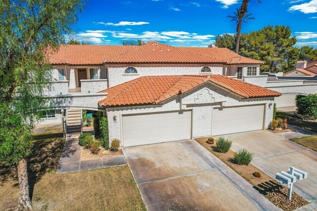 344 Vista Royal Dr, Palm Desert, CA 92211 - mediterranean / spanish-style house featuring stucco siding, a tile roof, and concrete driveway