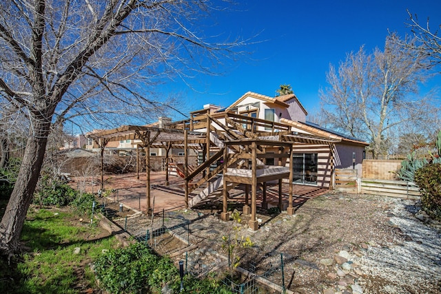 rear view of property with a wooden deck