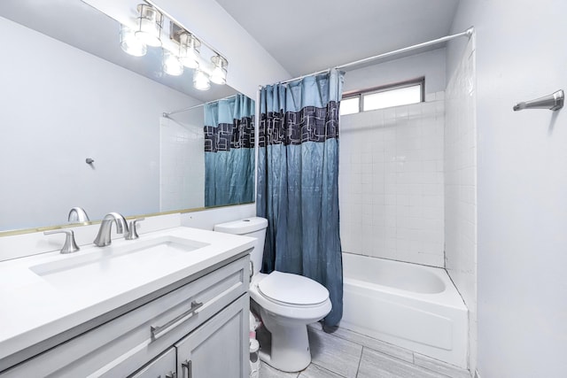 full bathroom featuring shower / bath combination with curtain, vanity, and toilet