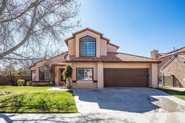 mediterranean / spanish home with a garage and a front lawn