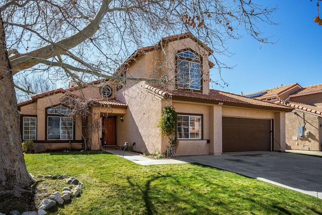 view of front of home with a front yard and a garage