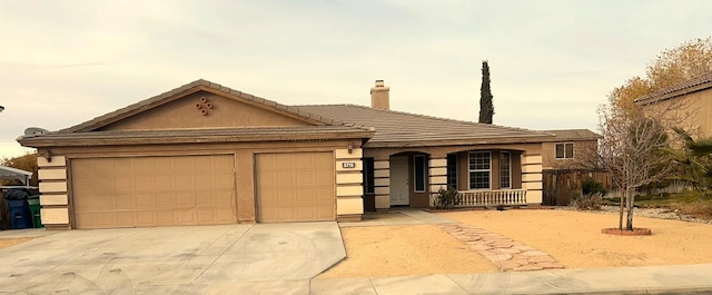 view of front of home with a porch and a garage