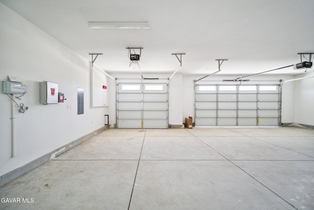 39635 Nicholas Ct, Palmdale, CA 93551 - garage with electric panel and a garage door opener