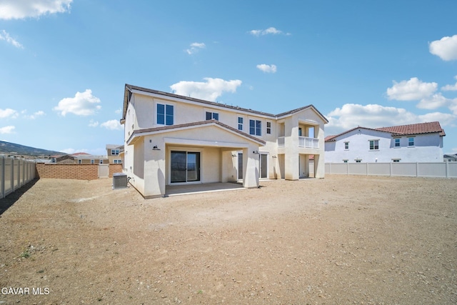 39635 Nicholas Ct, Palmdale, CA 93551 - back of house featuring a patio, stucco siding, and a fenced backyard