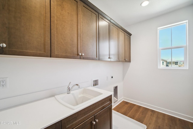 39635 Nicholas Ct, Palmdale, CA 93551 - laundry area featuring cabinet space, washer hookup, hookup for an electric dryer, dark wood-type flooring, and recessed lighting