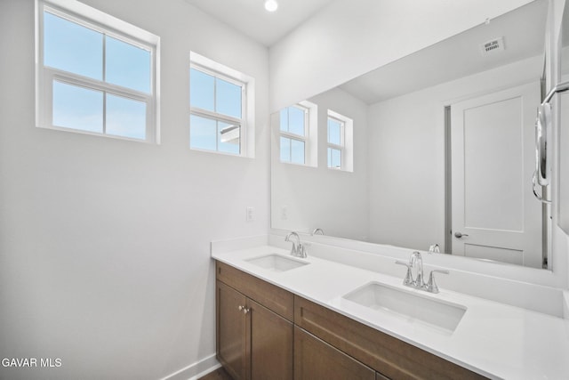 39635 Nicholas Ct, Palmdale, CA 93551 - bathroom with double vanity and baseboards