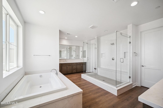 39635 Nicholas Ct, Palmdale, CA 93551 - bathroom featuring vanity, a shower stall, a bath, wood finished floors, and recessed lighting