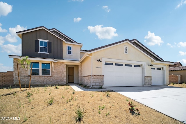 39635 Nicholas Ct, Palmdale, CA 93551 - view of front of property featuring stone siding, an attached garage, concrete driveway, board and batten siding, and stucco siding