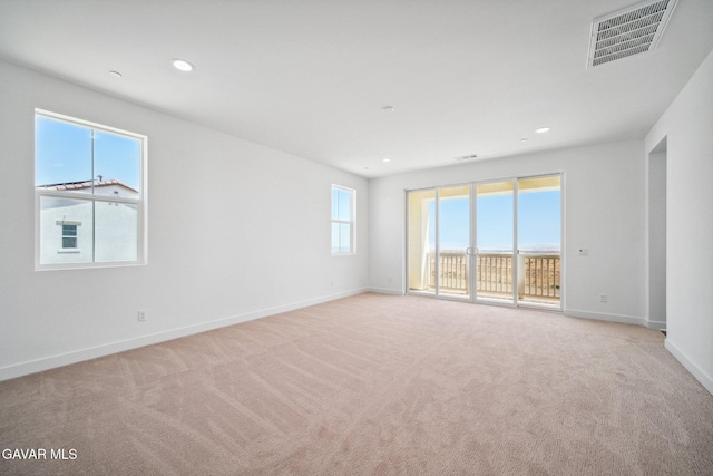 39635 Nicholas Ct, Palmdale, CA 93551 - empty room featuring light carpet and recessed lighting