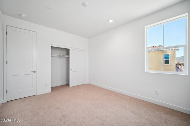 39635 Nicholas Ct, Palmdale, CA 93551 - unfurnished bedroom with light carpet, a closet, and recessed lighting
