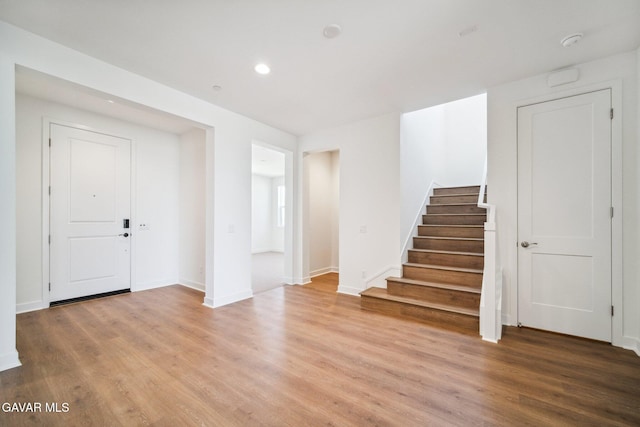 39635 Nicholas Ct, Palmdale, CA 93551 - entrance foyer featuring light wood-style floors, stairs, and recessed lighting