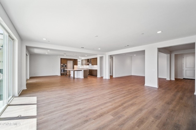 39635 Nicholas Ct, Palmdale, CA 93551 - unfurnished living room with recessed lighting and light wood finished floors