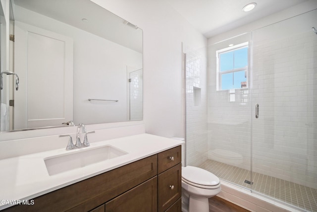 39635 Nicholas Ct, Palmdale, CA 93551 - bathroom featuring vanity, a shower stall, recessed lighting, and wood finished floors